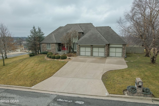 view of front facade with a garage and a front lawn