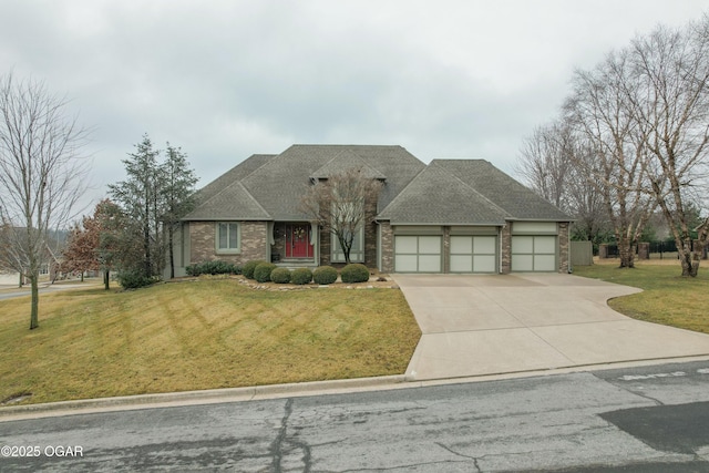 view of front of property featuring a garage and a front lawn