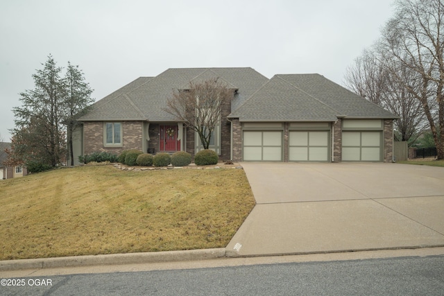 view of front of property featuring a garage and a front yard