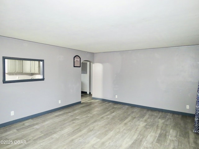 unfurnished room featuring light hardwood / wood-style floors