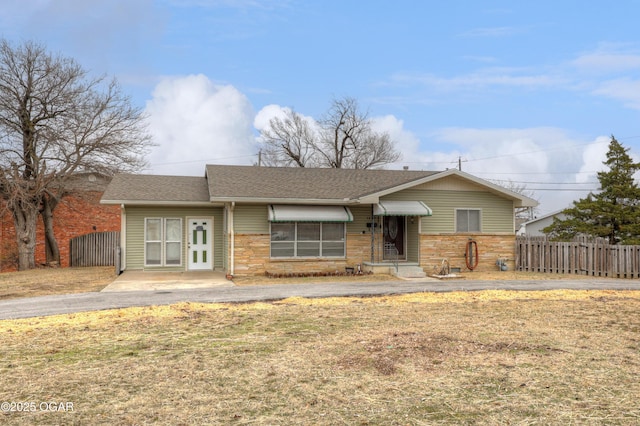 ranch-style house with a front lawn