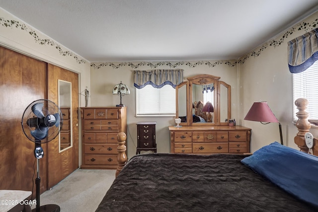 bedroom with light carpet