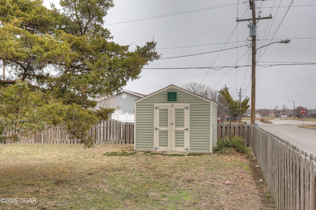 view of outbuilding with a yard