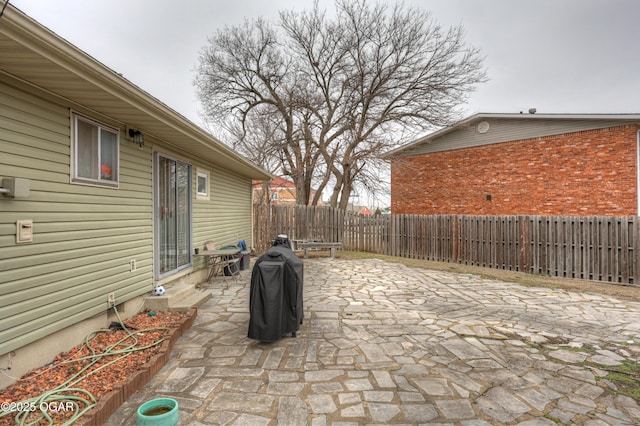 view of patio featuring a grill