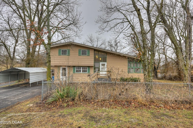 view of front of home with a carport