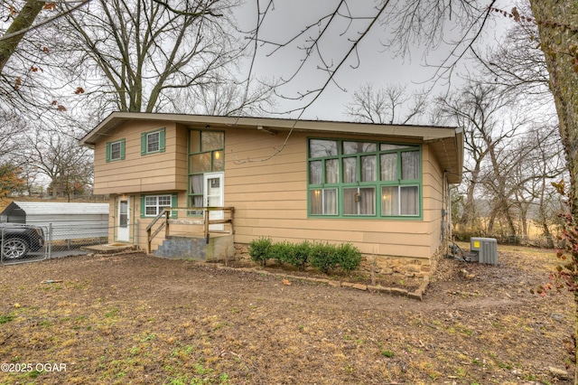 view of front facade featuring central AC unit