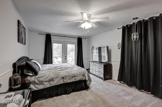 bedroom featuring light carpet, access to exterior, french doors, and ceiling fan