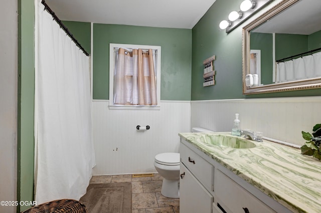 bathroom with vanity and toilet