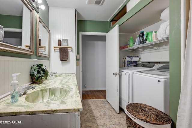 laundry area featuring washer and dryer and sink