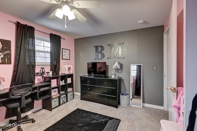 interior space featuring ceiling fan and a textured ceiling