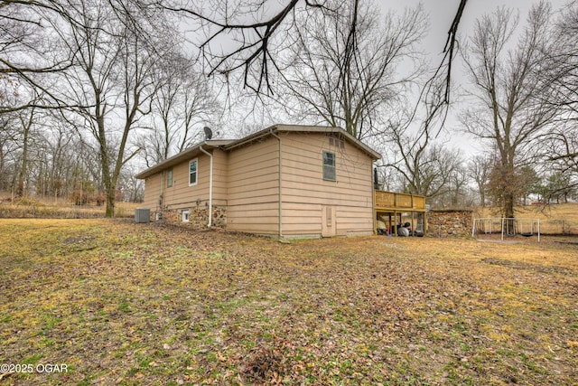 view of home's exterior featuring a deck and central air condition unit