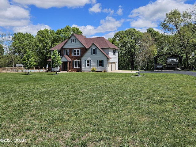 craftsman house featuring fence, a front yard, brick siding, concrete driveway, and an attached garage