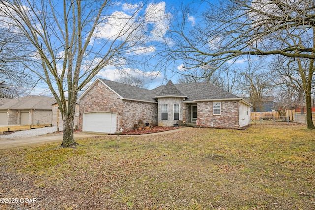 view of front facade featuring a garage and a front lawn