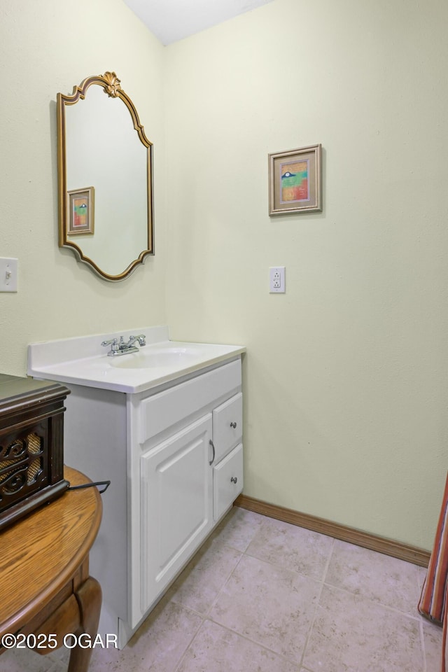 bathroom featuring tile patterned flooring and vanity