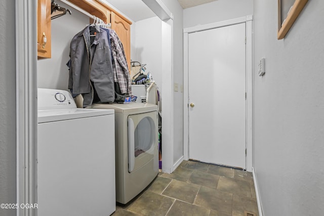 washroom with cabinets and separate washer and dryer