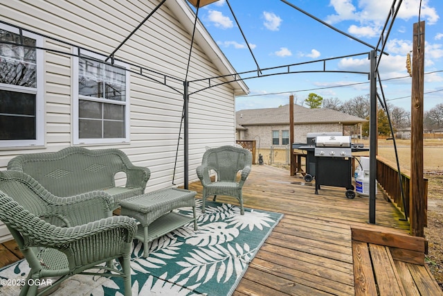 wooden deck featuring area for grilling