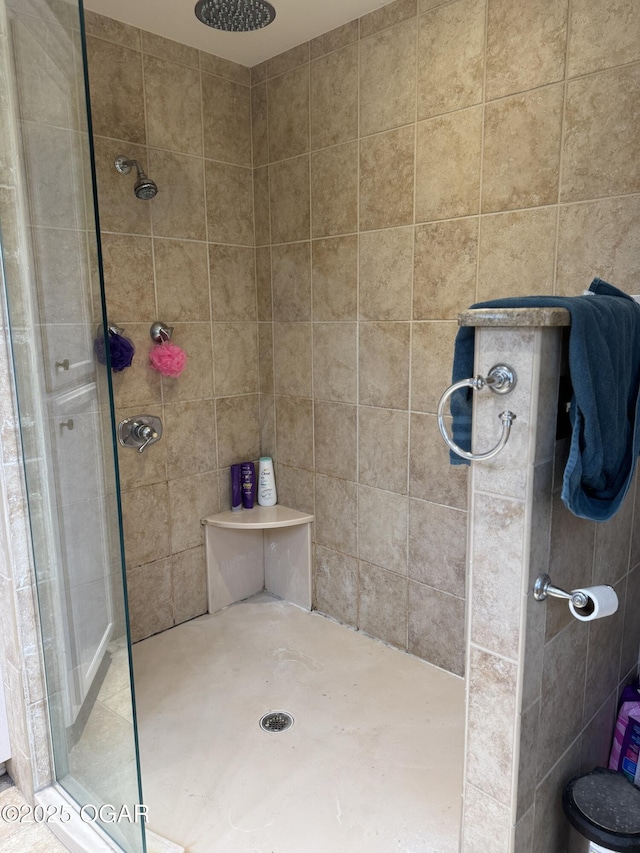 bathroom with a shower with shower door