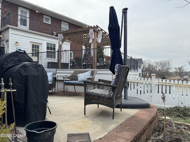 view of patio / terrace with a balcony, outdoor lounge area, and a pergola