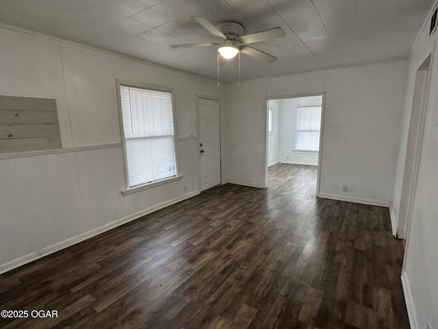 unfurnished room with dark hardwood / wood-style flooring and ceiling fan