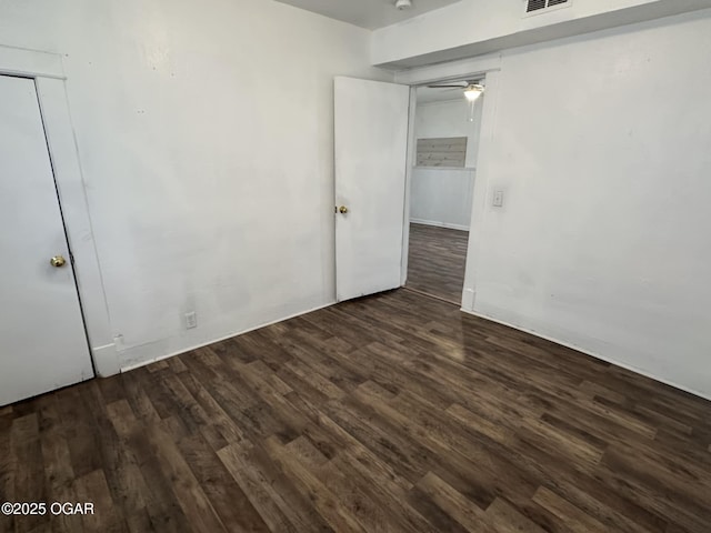 unfurnished bedroom with dark hardwood / wood-style floors