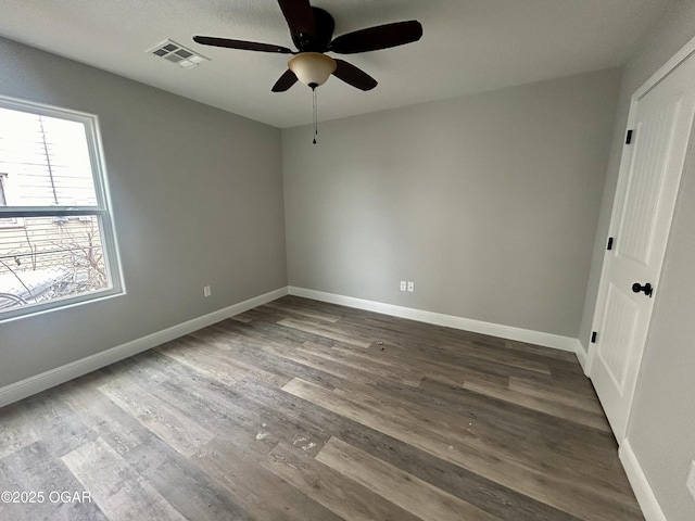 empty room featuring ceiling fan and wood-type flooring