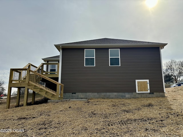 view of property exterior with a deck