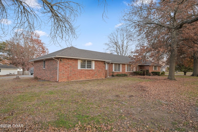 ranch-style house with a front yard