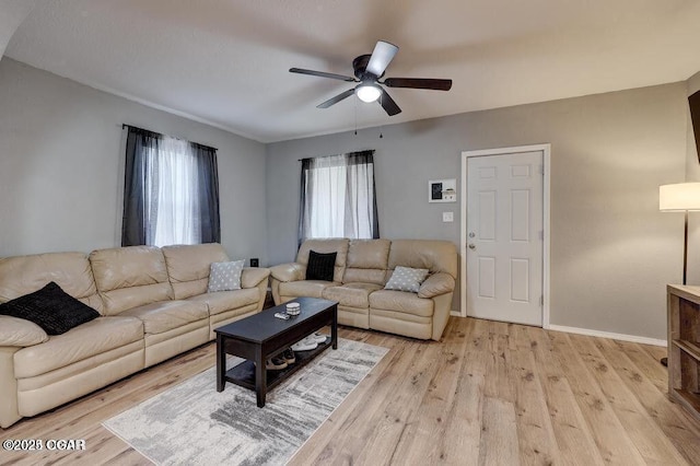 living room featuring ceiling fan and light wood-type flooring