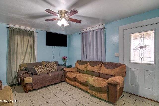 tiled living room with ceiling fan