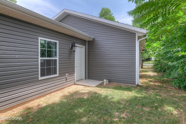 entrance to property with a yard