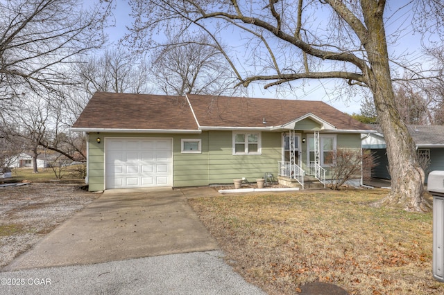 ranch-style house featuring a garage and a front yard