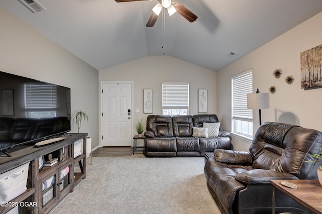 carpeted living room with vaulted ceiling and ceiling fan