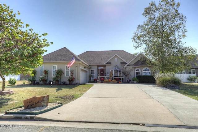 single story home featuring a garage and a front lawn