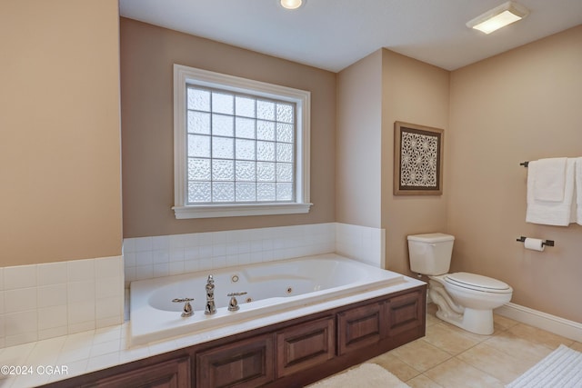 bathroom with a bathtub, tile patterned floors, and toilet