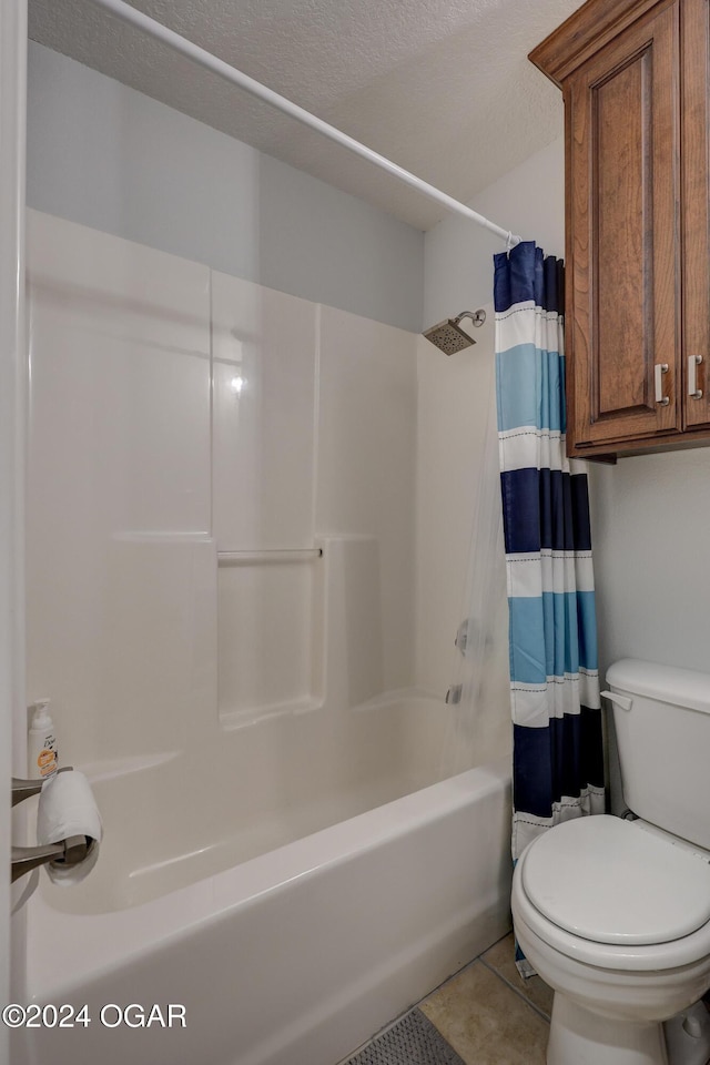 bathroom with toilet, tile patterned floors, shower / bathtub combination with curtain, and a textured ceiling