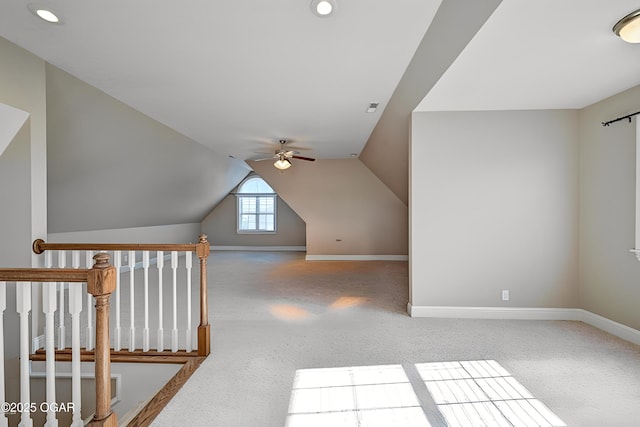 additional living space with carpet floors, vaulted ceiling, and ceiling fan