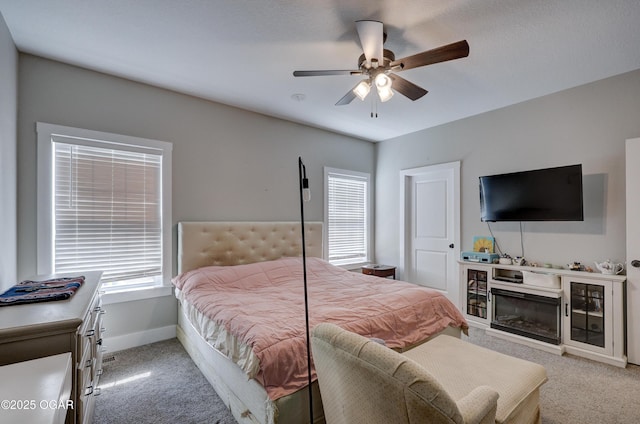 bedroom with light carpet and ceiling fan