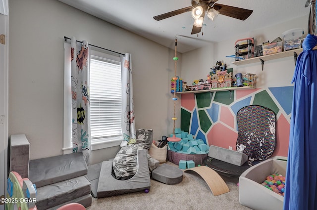 game room with ceiling fan and carpet floors