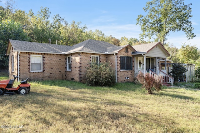 ranch-style house with a front lawn