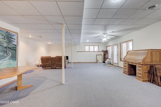 basement with carpet floors and a drop ceiling