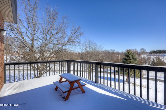 snow covered deck featuring a swimming pool