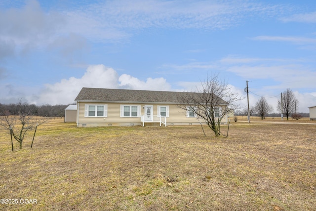 ranch-style house featuring a front lawn