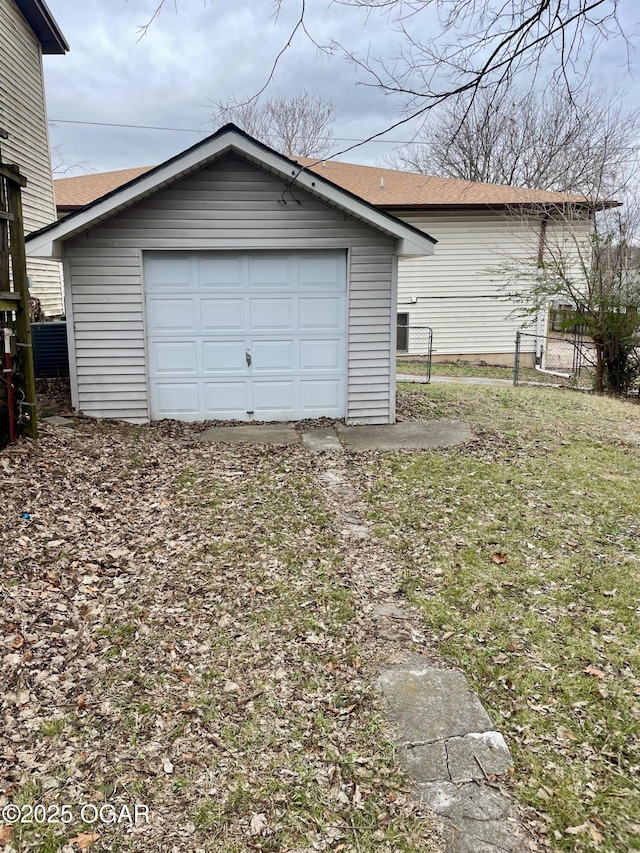 detached garage with fence