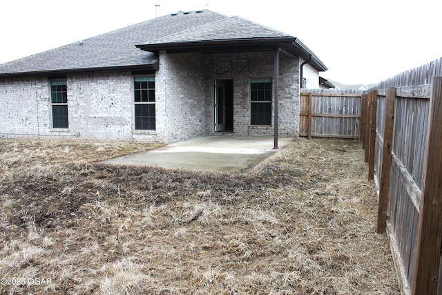 rear view of house with a patio