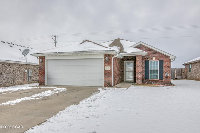 ranch-style house with brick siding and an attached garage