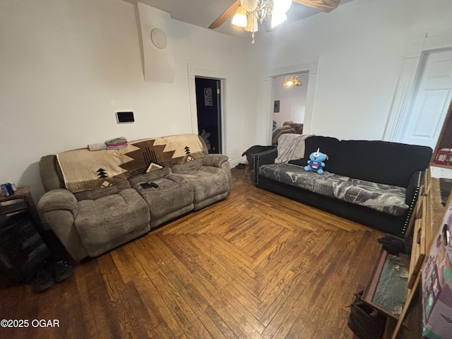 living room with ceiling fan and wood finished floors