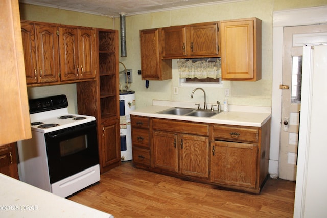 kitchen featuring light countertops, light wood-type flooring, water heater, a sink, and range with electric stovetop