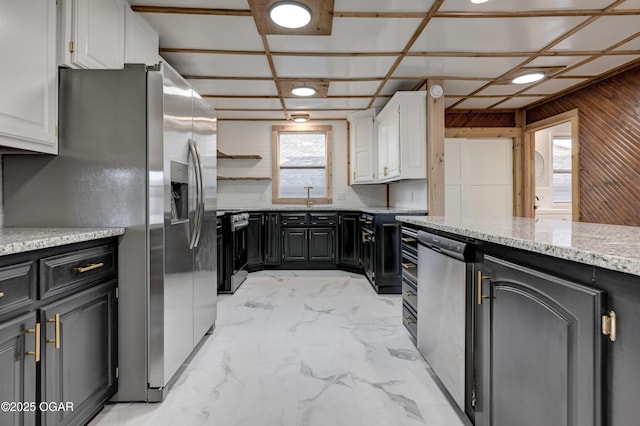 kitchen with range with electric cooktop, a sink, white cabinetry, marble finish floor, and stainless steel fridge with ice dispenser