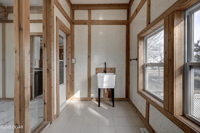 interior space with visible vents and tile patterned floors