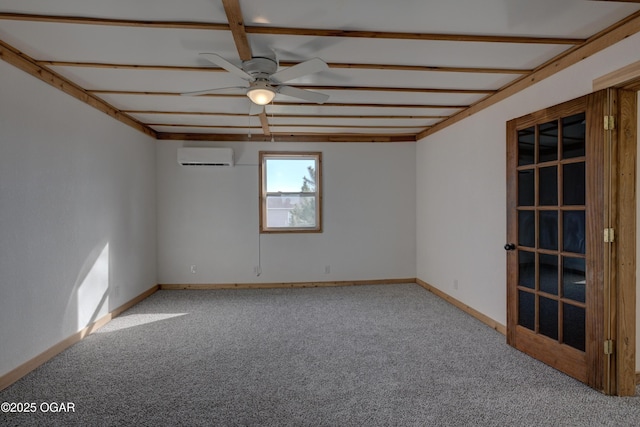 carpeted empty room with ceiling fan, baseboards, and an AC wall unit